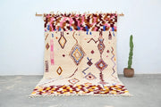 Beige moroccan azilal rug handmade by decorbites with colorful geometric patterns and fringed edges 309x207cm