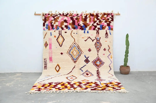 Beige moroccan azilal rug handmade by decorbites with colorful geometric patterns and fringed edges 309x207cm