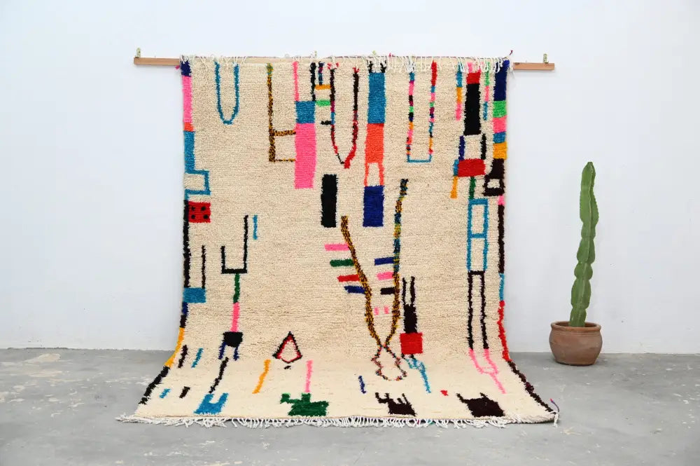 Beige moroccan azilal rug with vibrant pink blue green and black wool geometric patterns handmade 313x194cm decorbites