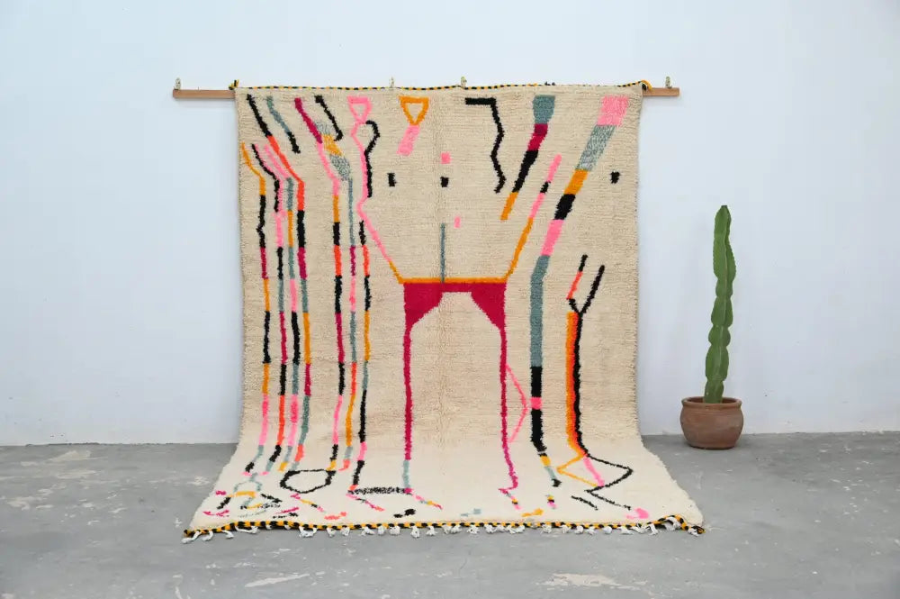 Beige handmade moroccan azilal rug with vibrant abstract geometric patterns in pink black orange and teal 315x194 cm