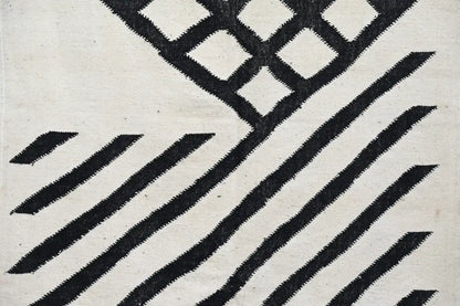 Black and white geometric patterned woven textile of decorbites handmade moroccan azilal rug 317x200 cm