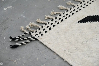 DecorBites handmade moroccan azilal rug 317x200 cm with black and white geometric pattern and fringed edges