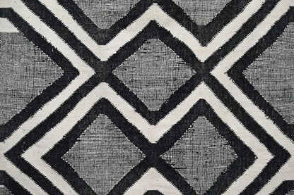 Black and white geometric patterned handmade traditional azilal rug with woven texture by decorbites 326x203 cm