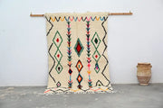 Beige DecorBites™ handmade traditional azilal rug with colorful geometric patterns and fringed edges 240x150cm