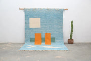 Blue woven decorbites™ handmade traditional azilal rug 300x200cm with cream orange and green geometric patterns