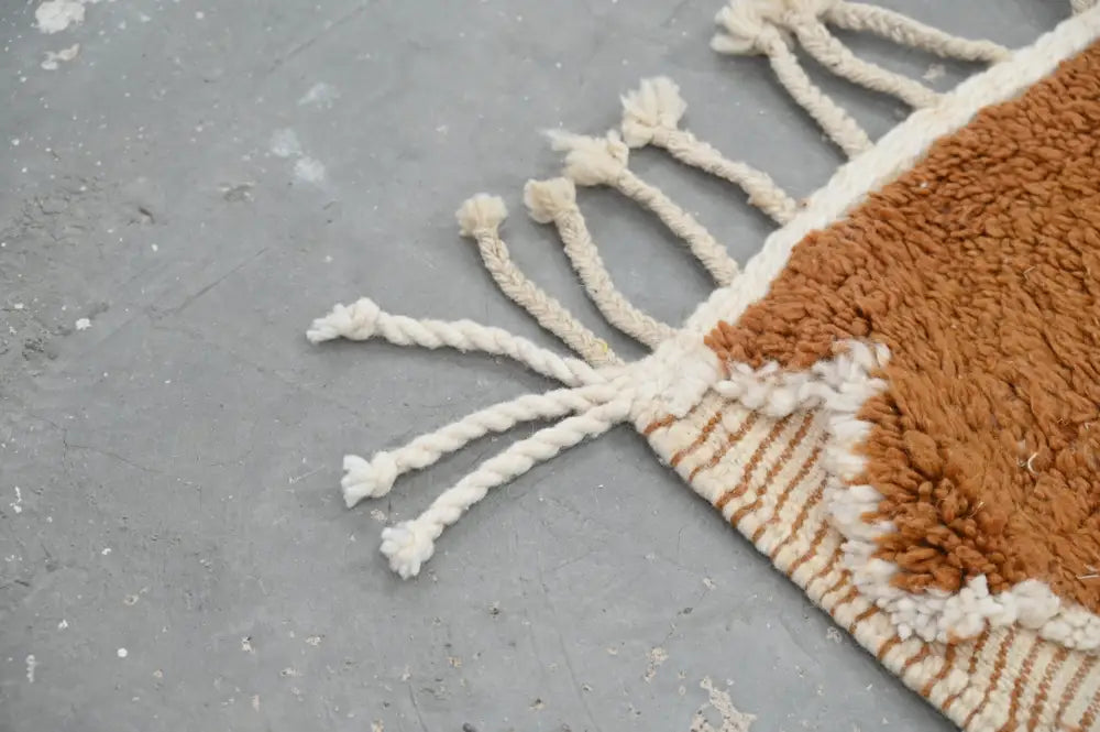DecorBites™ handmade traditional azilal rug with warm terracotta body and cream fringe tassels 328x197cm