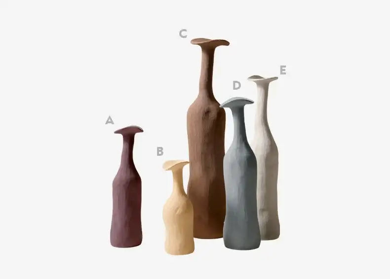 A set of five decorbites™ handmade nordic ceramic flower vases in earthy tones with unique shapes and matte finish