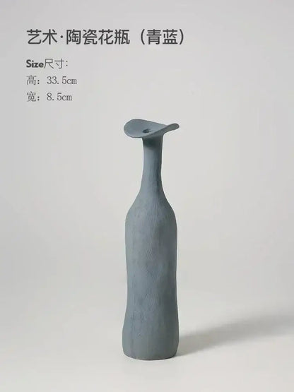 DecorBites™ handmade nordic ceramic flower vase in matte teal blue with elongated neck and flared top for luxury home
