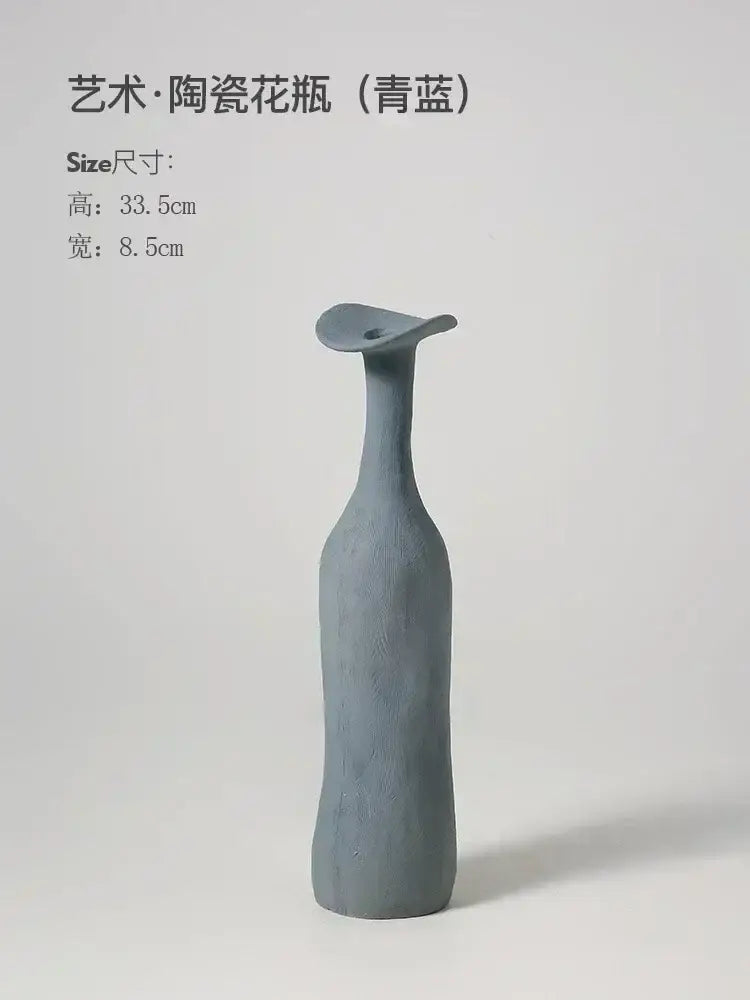 DecorBites™ handmade nordic ceramic flower vase in matte teal blue with elongated neck and flared top for luxury home