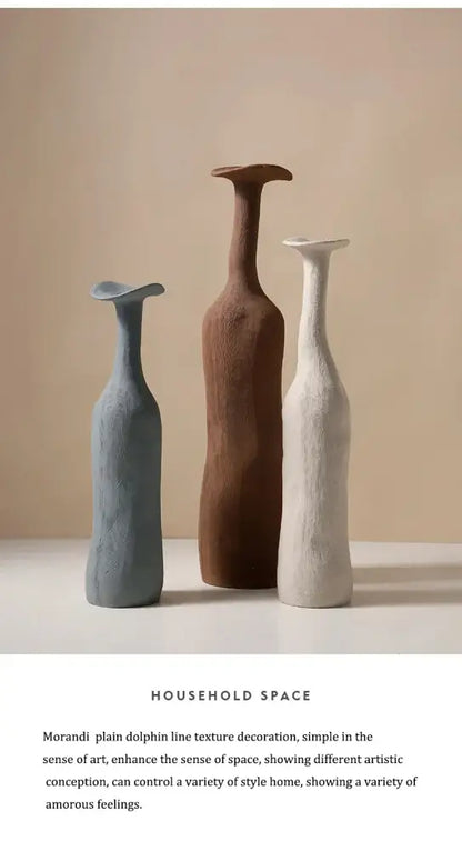 Three handcrafted ceramic flower vases by decorbites in muted gray brown and off-white with textured dolphin-line contours