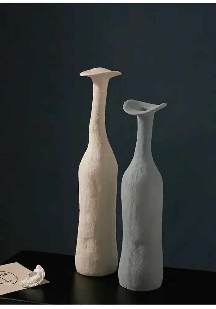 Two minimalist ceramic flower vases by DecorBites™ with matte textured finishes in creamy off-white and soft gray