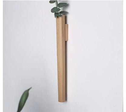 Minimalist light oak solid wood wall vase handmade Nordic design with sleek rectangular shape and vertical slot for plants