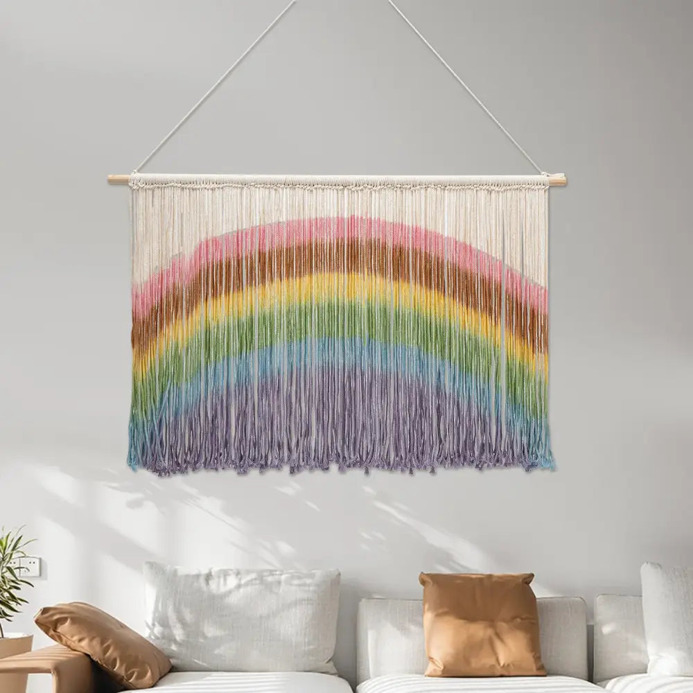 Colorful handmade weaving rainbow macrame wall hanging with wooden dowel and vibrant yarn strands for wall decor