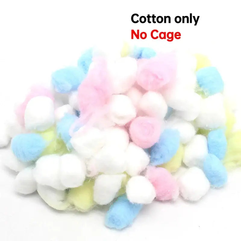 A pile of pastel pink blue white and yellow soft cotton balls beside decorbites handwoven grass bird cage hut