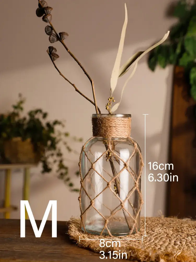 Clear glass hanging vase with woven jute netting and natural hemp rope wrapping by decorbites for rustic decor