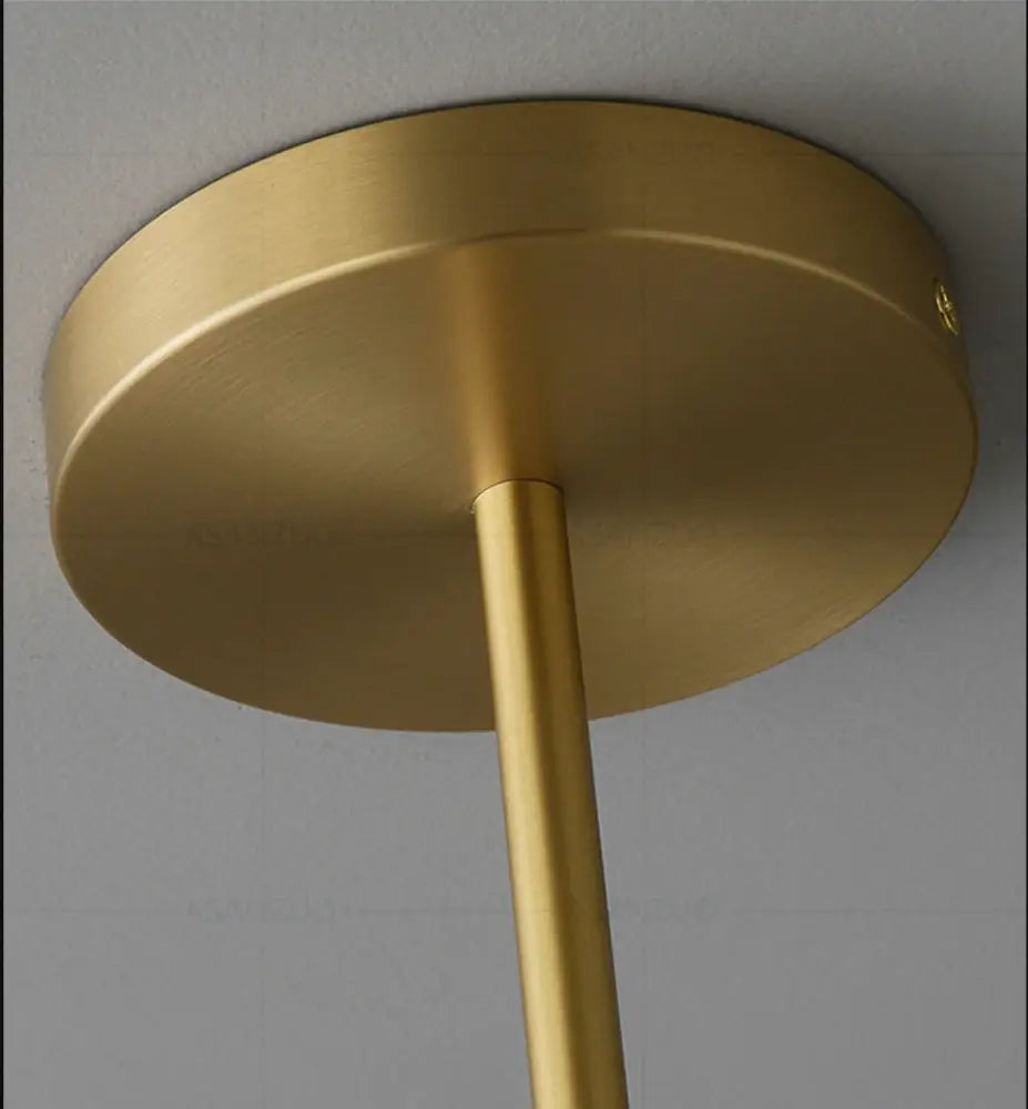 Decorbites™ hanging lights brass-finished ceiling fixture with circular base and slender rod offering versatile lighting options in gold finishes