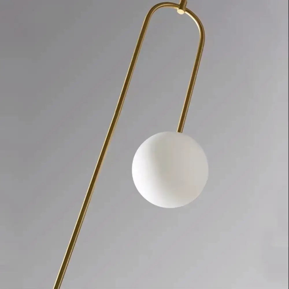 Decorbites™ hanging lights feature a minimalist gold finish metal frame with a white glass shade for versatile lighting options