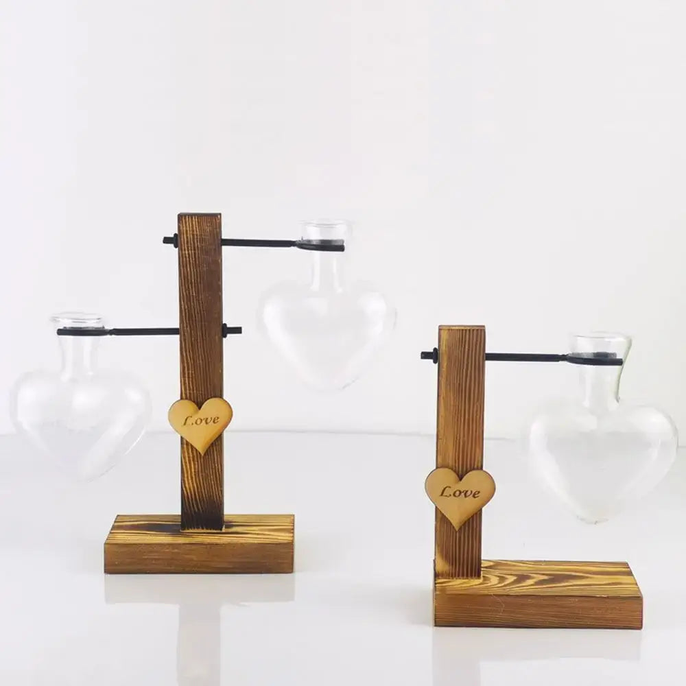DecorBites heart shape hydroponic glass vase mounted on rustic wooden stand with engraved love heart charm