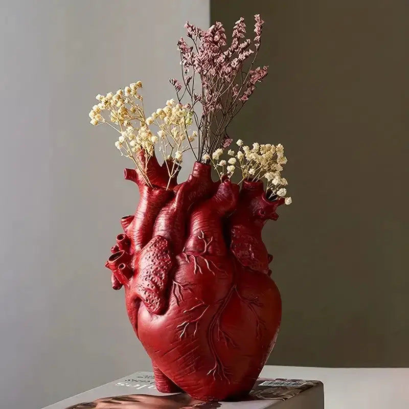 Red heart shape resin vase with detailed texture holding dried flowers from decorbites™ four color options