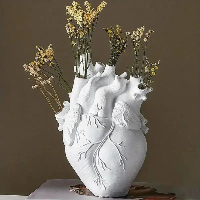 White ceramic heart shape resin vase with detailed anatomical features from decorbites in four colors