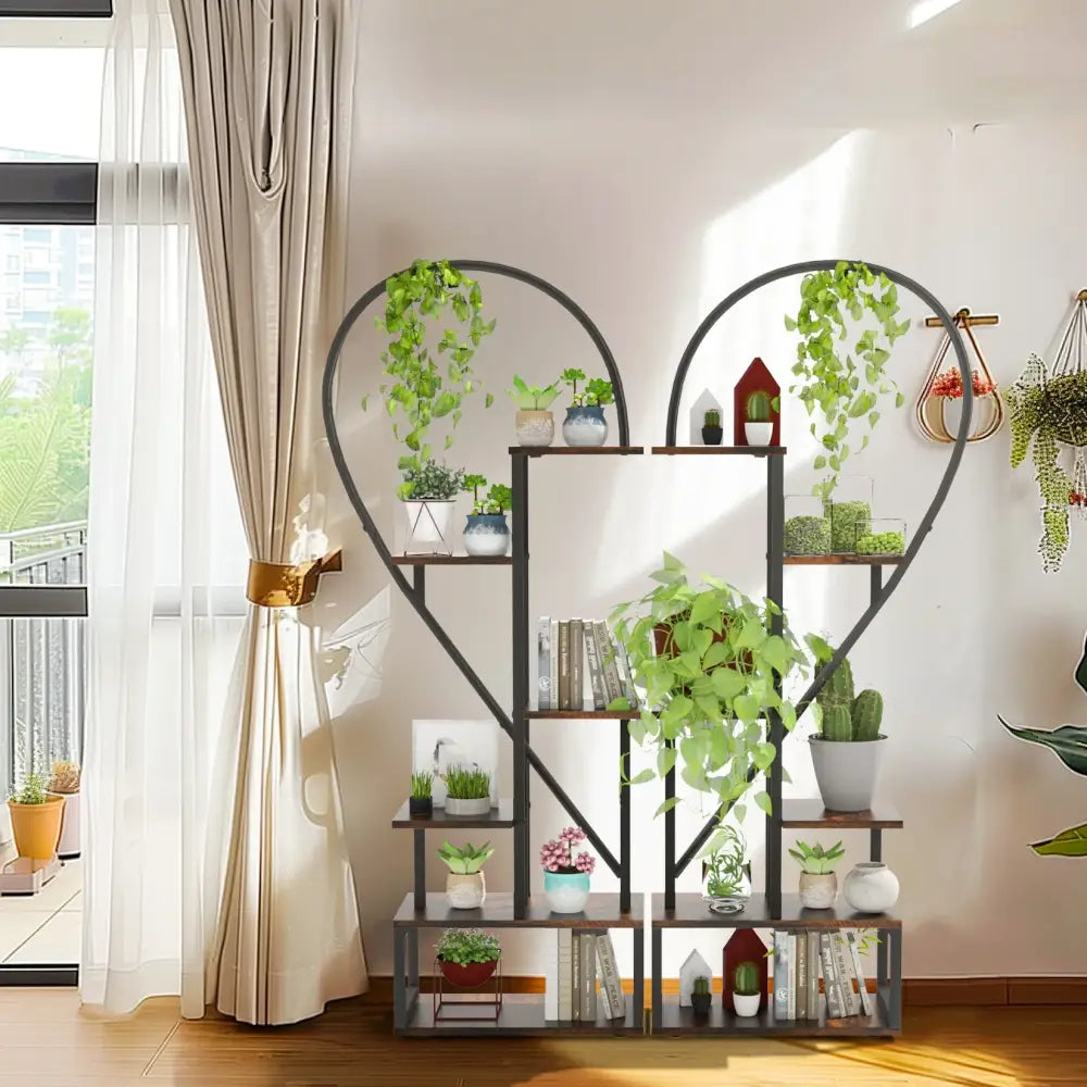DecorBites heart shaped 6-tier metal plant stand with dark brown wooden shelves and black frame holding potted plants
