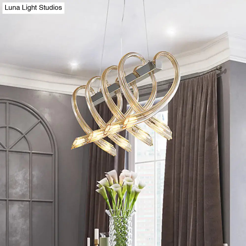 Decorbites heart-shaped chrome island light featuring amber glass with gold-toned arms in minimalist 220v-240v 110v-120v design