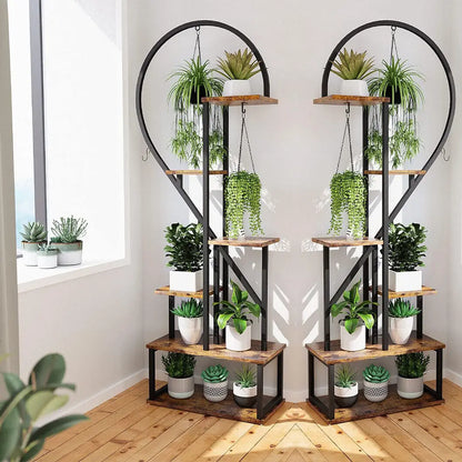 Rustic wooden and black metal heart shape plant stand with hooks for 20 pots holding various potted plants