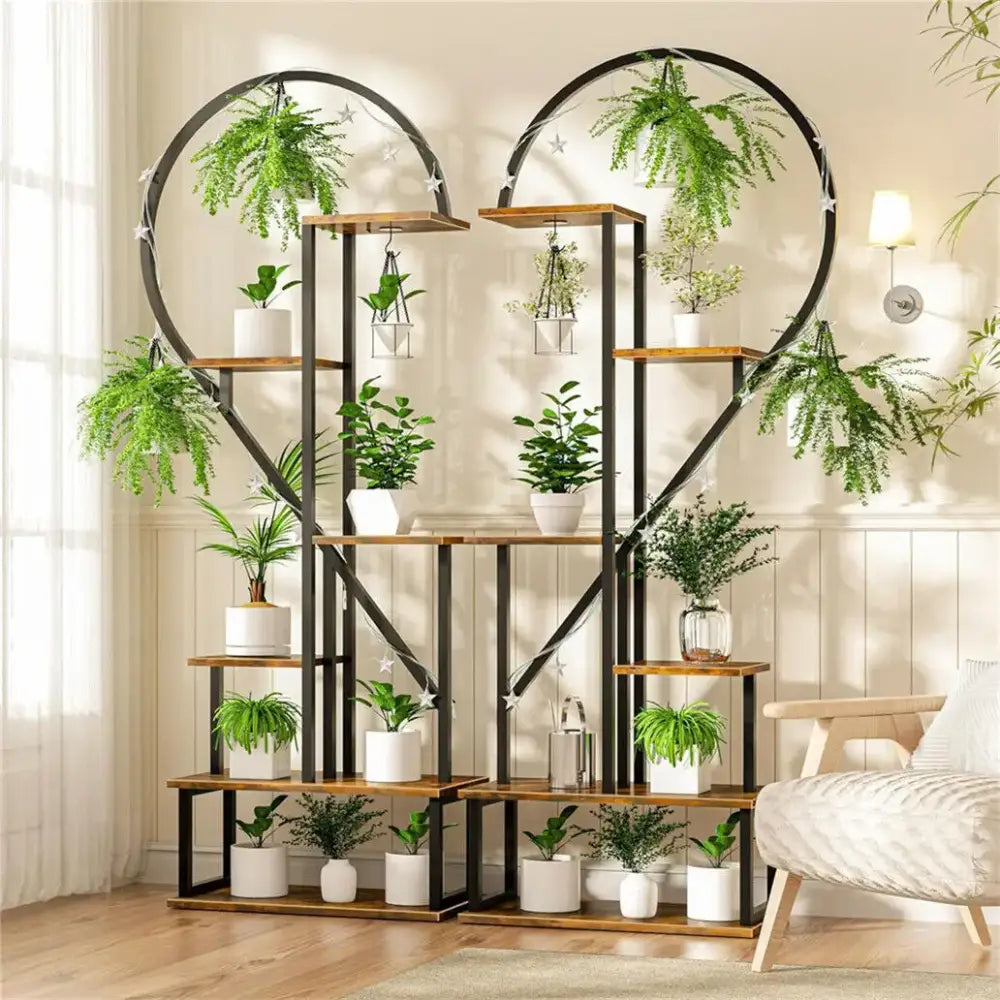 DecorBites™ heart-shaped metal and wood plant stand with multiple shelves holding green plants and hooks for 20 pots