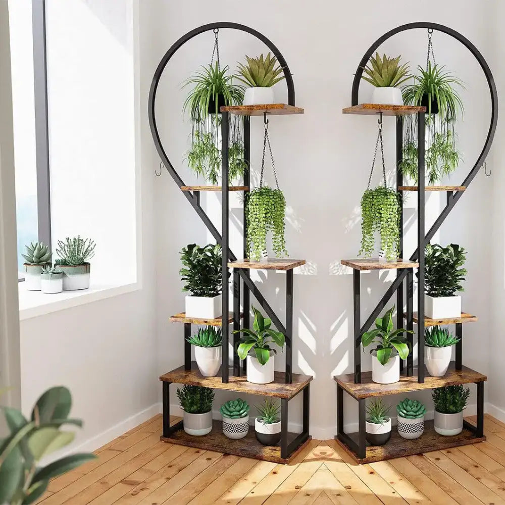 Rustic wooden and black metal heart shape plant stand with hooks for 20 pots holding various potted plants
