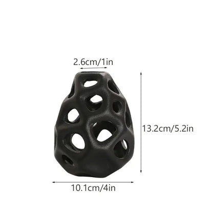 Black textured ceramic vase with geometric perforated design in nordic classical style by decorbites