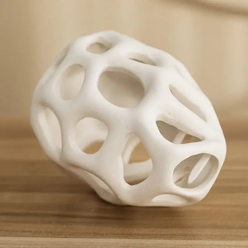 White ceramic vase with organic lattice design featuring interconnected openings in nordic classical style