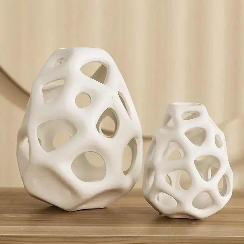 White ceramic vase with porous organic lattice design showcasing nordic classical style by DecorBites™