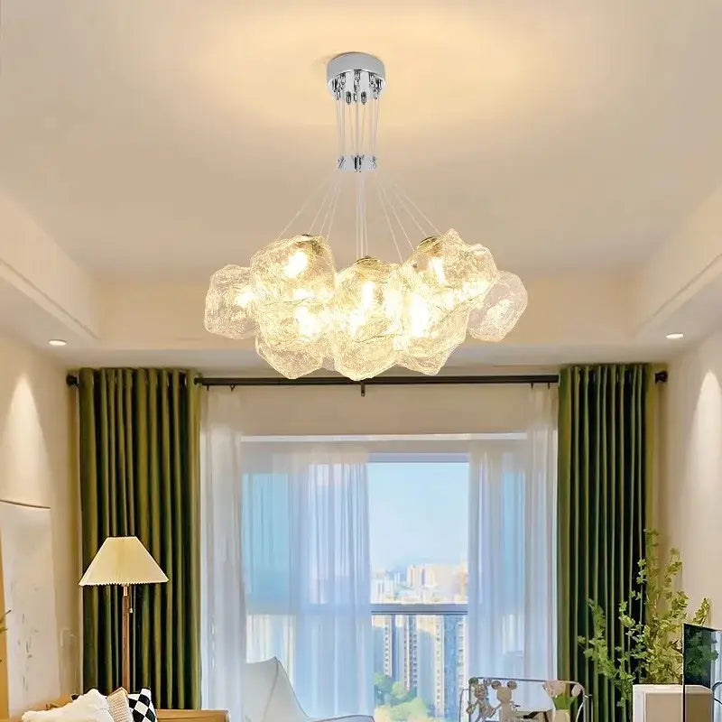 A decorbites iced crystal chandelier featuring cloud-like translucent glass orbs suspended from a chrome fixture