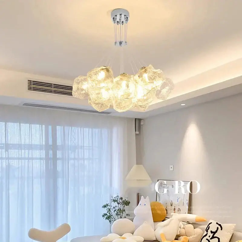 Modern chandelier with decorbites iced crystal translucent cloud glass globes and sleek chrome fixture for living room light