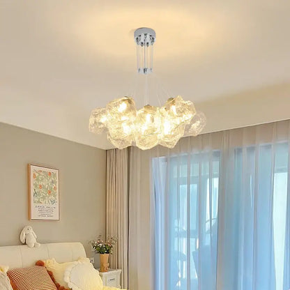 A modern decorbites iced crystal cloud LED chandelier with translucent bubble glass globes and chrome fixture for living room