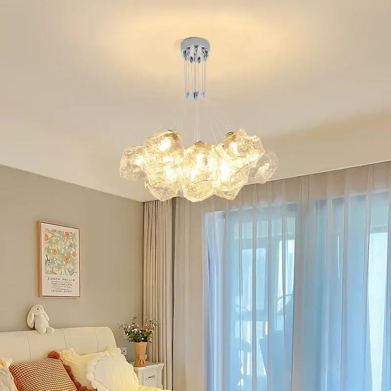 A modern decorbites iced crystal cloud LED chandelier with translucent bubble glass globes and chrome fixture for living room