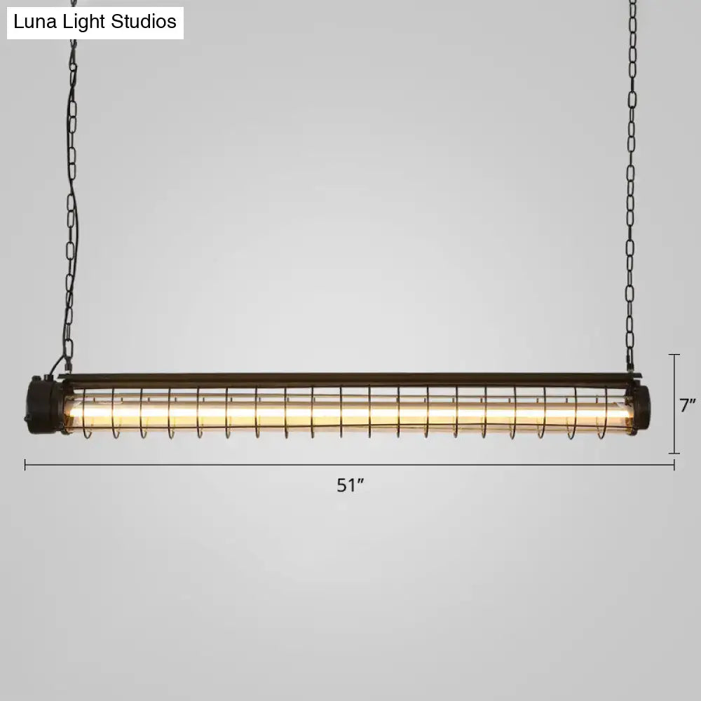 Industrial black cage island pendant with tubular cage design, black metal frame, and warm glow for dining room lighting