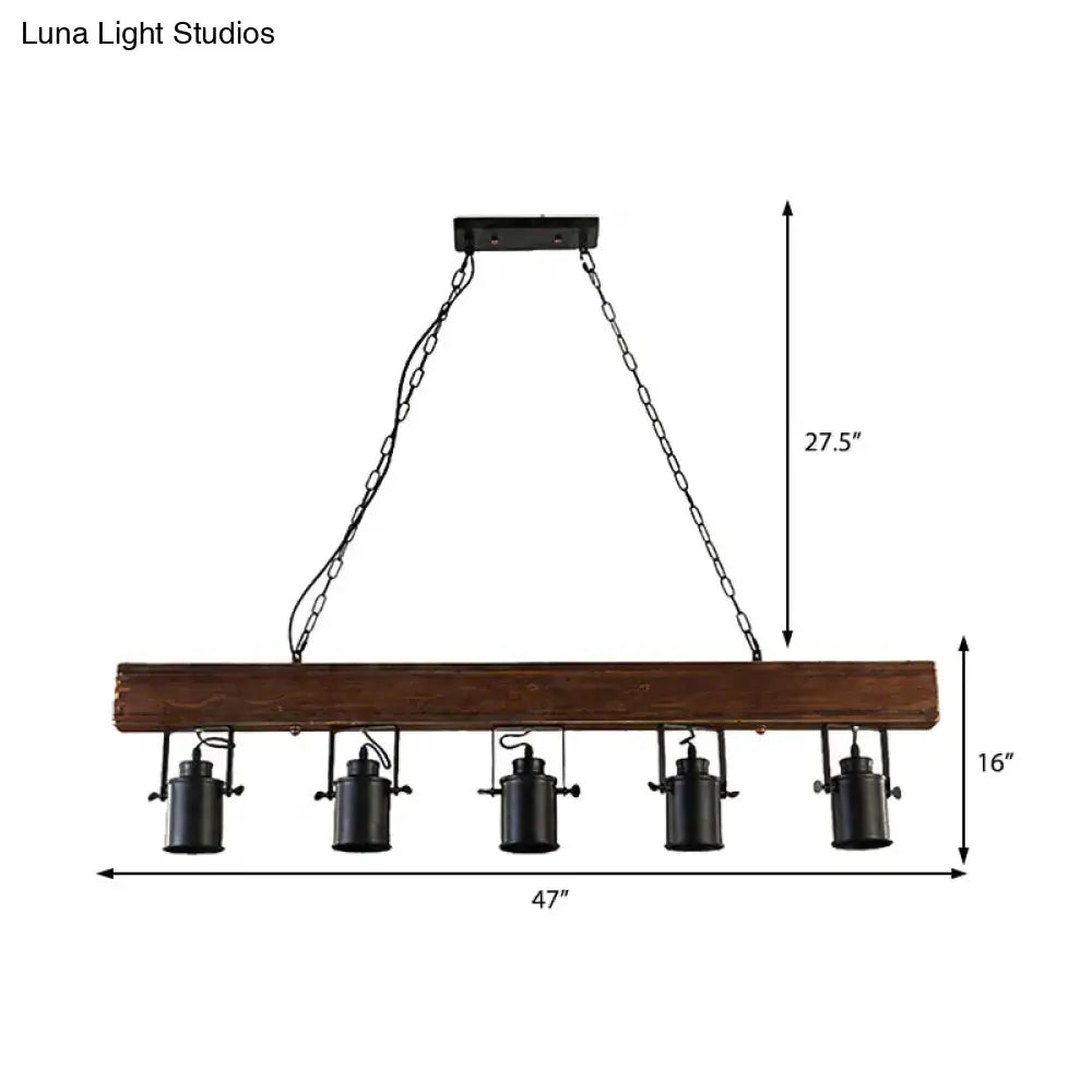 Decorbites™ industrial black metal island light fixture with five lamps hanging from chain cords on a dark brown wooden beam