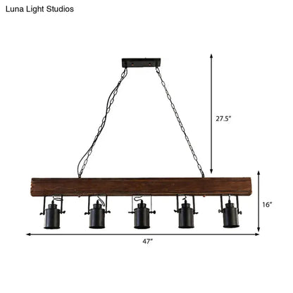 Decorbites™ industrial black metal island light fixture with five lamps hanging from chain cords on a dark brown wooden beam