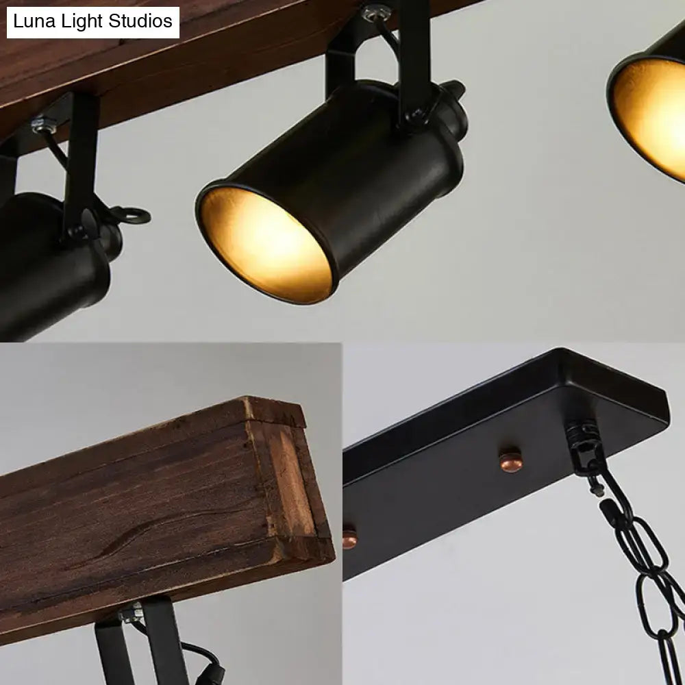 Decorbites industrial black metal light fixture with warm gold interiors mounted on rustic wood beam for island lighting
