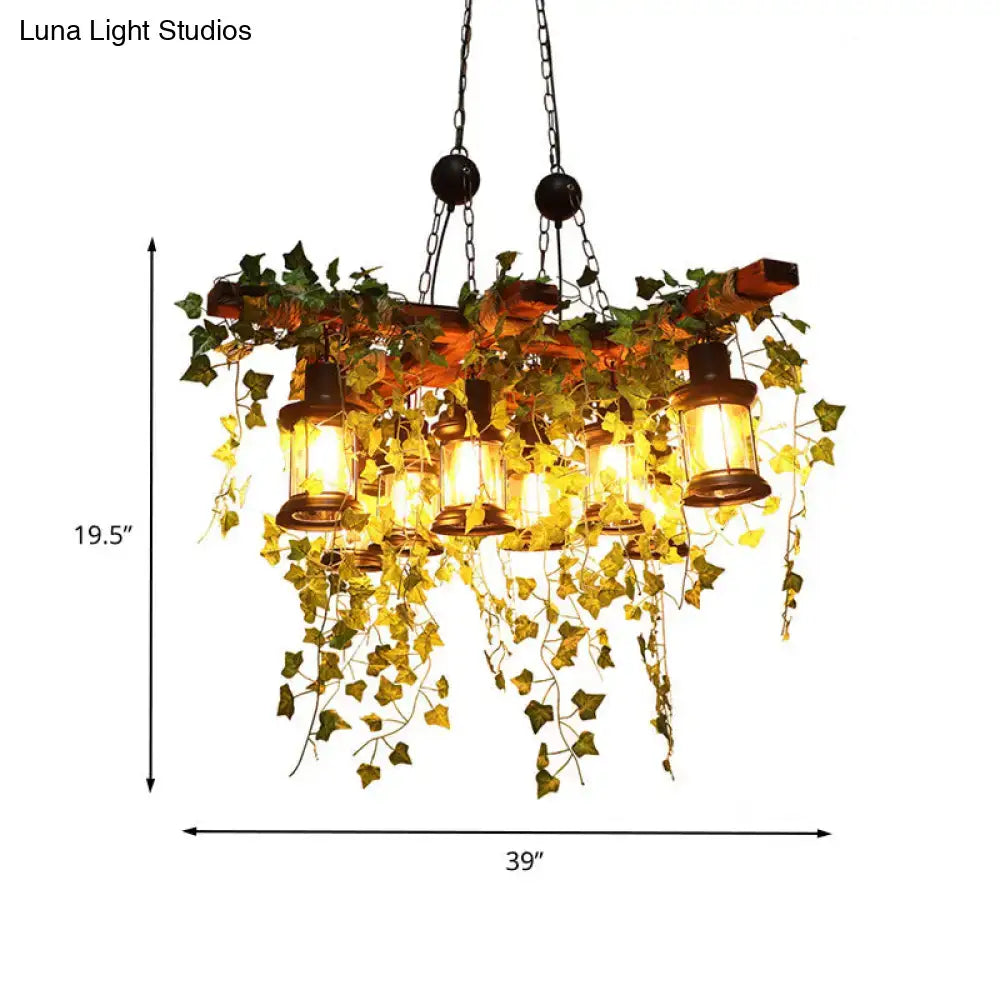 Rustic wooden chandelier featuring industrial black metal lantern island light with eight hanging lanterns and ivy vines
