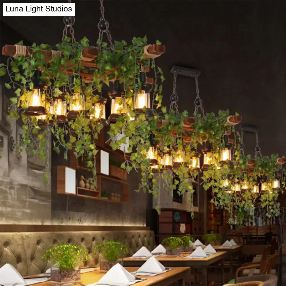 Decorbites™ industrial black metal lantern island light with rustic wooden beams woven rope and green ivy accents