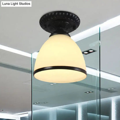 Black ornate semi flush ceiling light with milky glass dome flower shade and decorative metal trim for gallery use