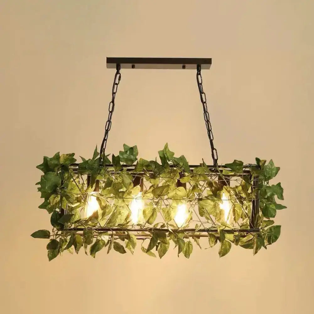 Rectangular wrought iron cage island pendant light with hanging green plant decoration and warm led incandescent bulbs