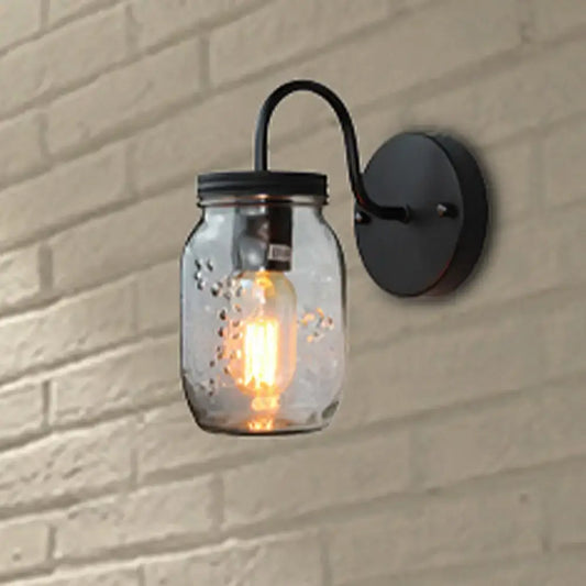 Industrial black jar shade clear glass wall lamp featuring a clear glass mason jar and exposed filament bulb