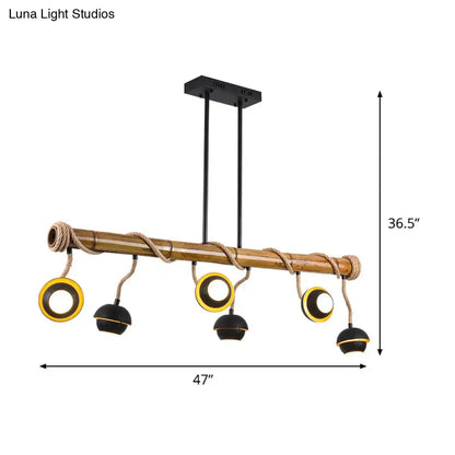 Rustic bamboo chandelier with black iron and gold accents industrial linear island pendant lamp with rope detail