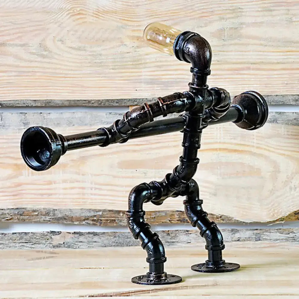 Black industrial metal athlete table lamp shaped like a standing figure with exposed bulb head for 220v-240v use