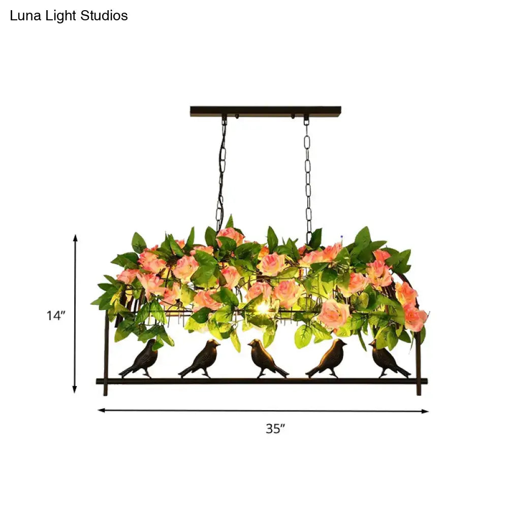 Black industrial metal birdcage hanging ceiling light with pink roses green leaves and five bird silhouettes base