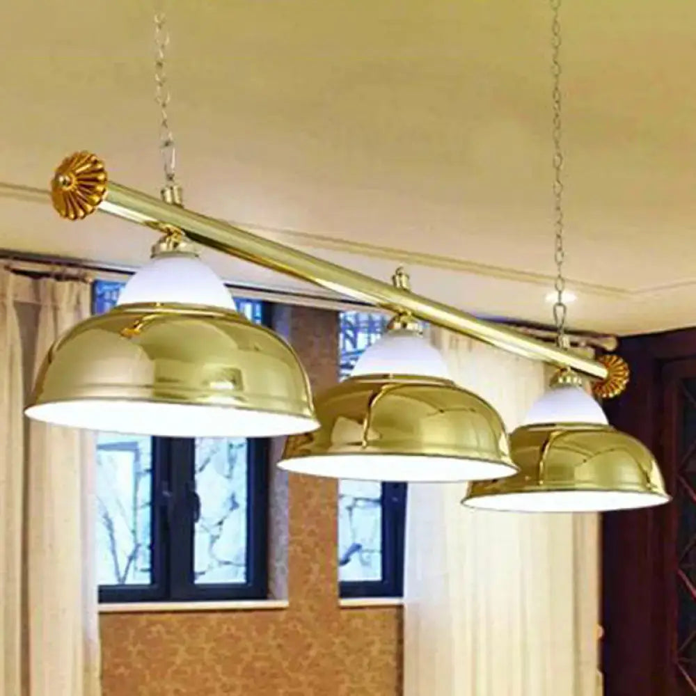 Gold-colored brass industrial metal mirrored bowl suspended lighting fixture with three dome shades for billiard room lighting