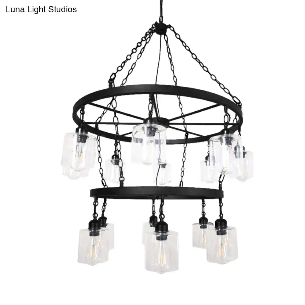Black wrought iron industrial pendant chandelier with two-tier wheel design and clear glass cylinder shades